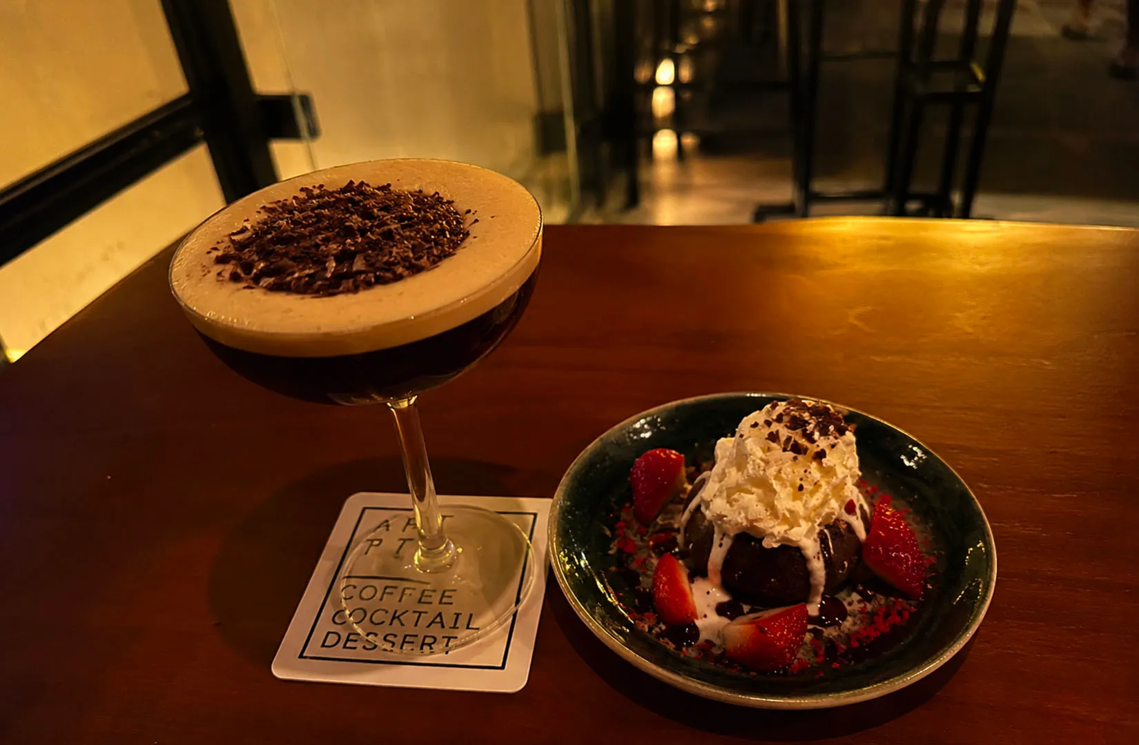 Dessert and cocktail pairing with chocolate and strawberries.