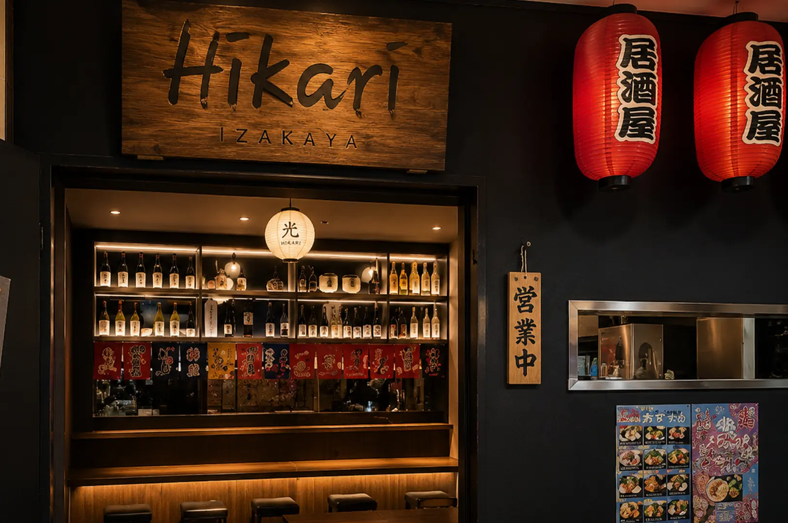 Entrance of Hikari Izakaya featuring a rustic wooden sign, red paper lanterns, and a view of illuminated sake bottles on shelves inside