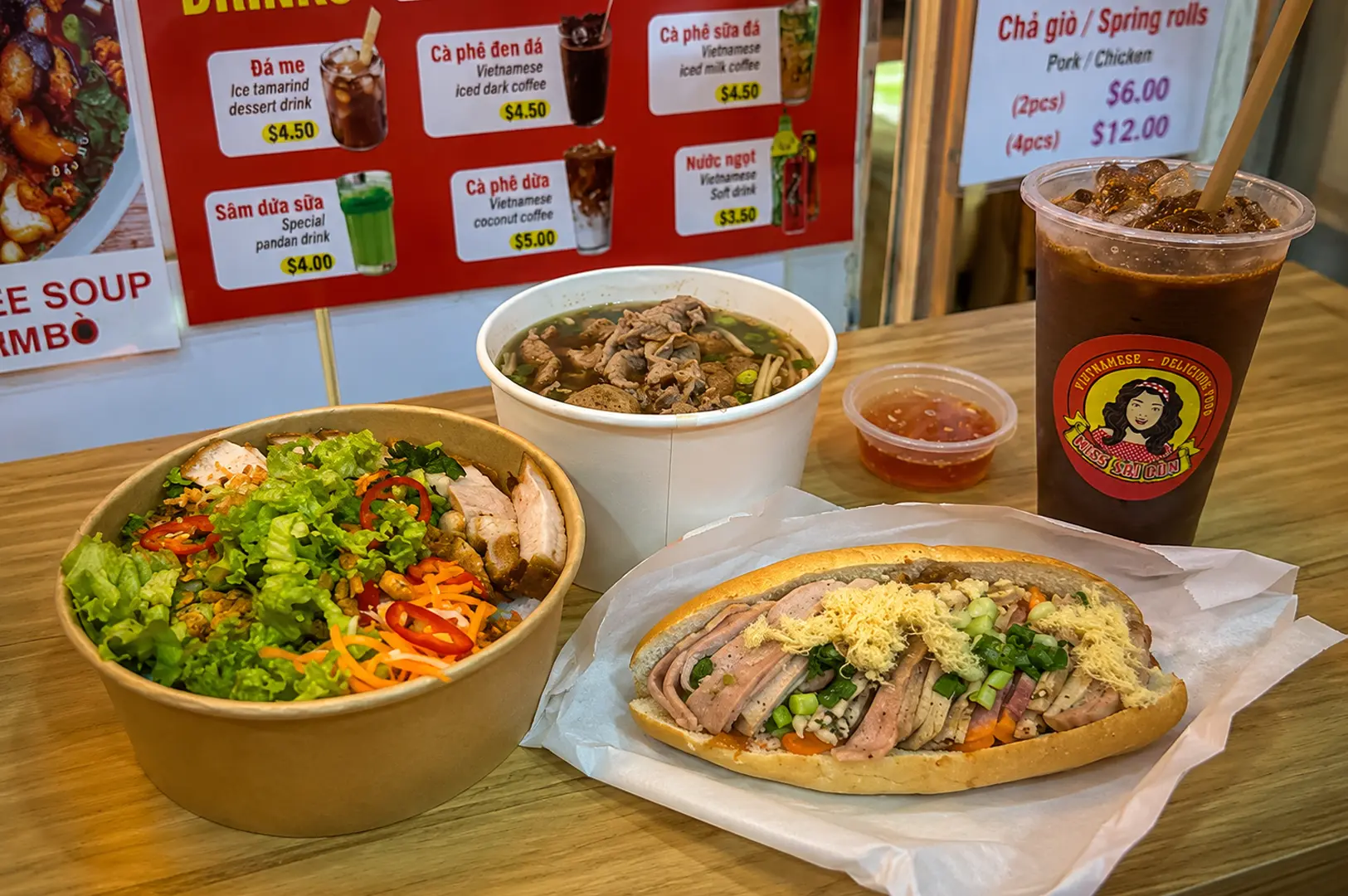 Late night Vietnamese spread with banh mi, pho, salad and iced coffee