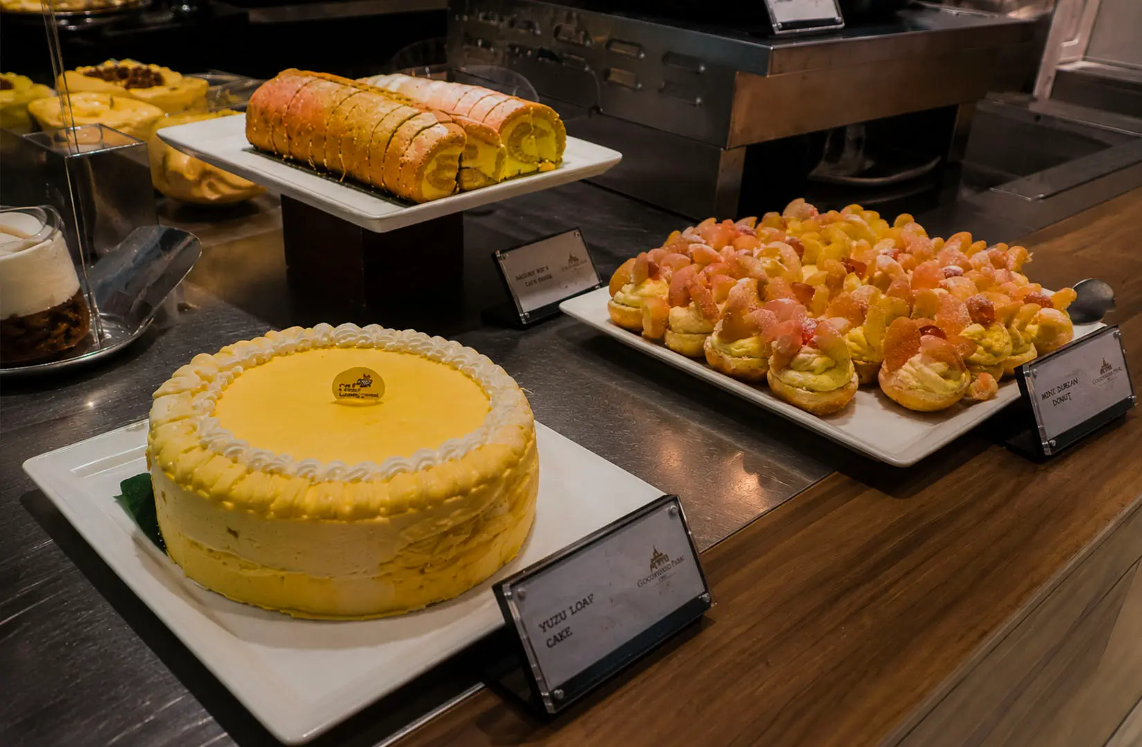 Yuzu cake and pastries displayed in a Singapore dessert buffet.