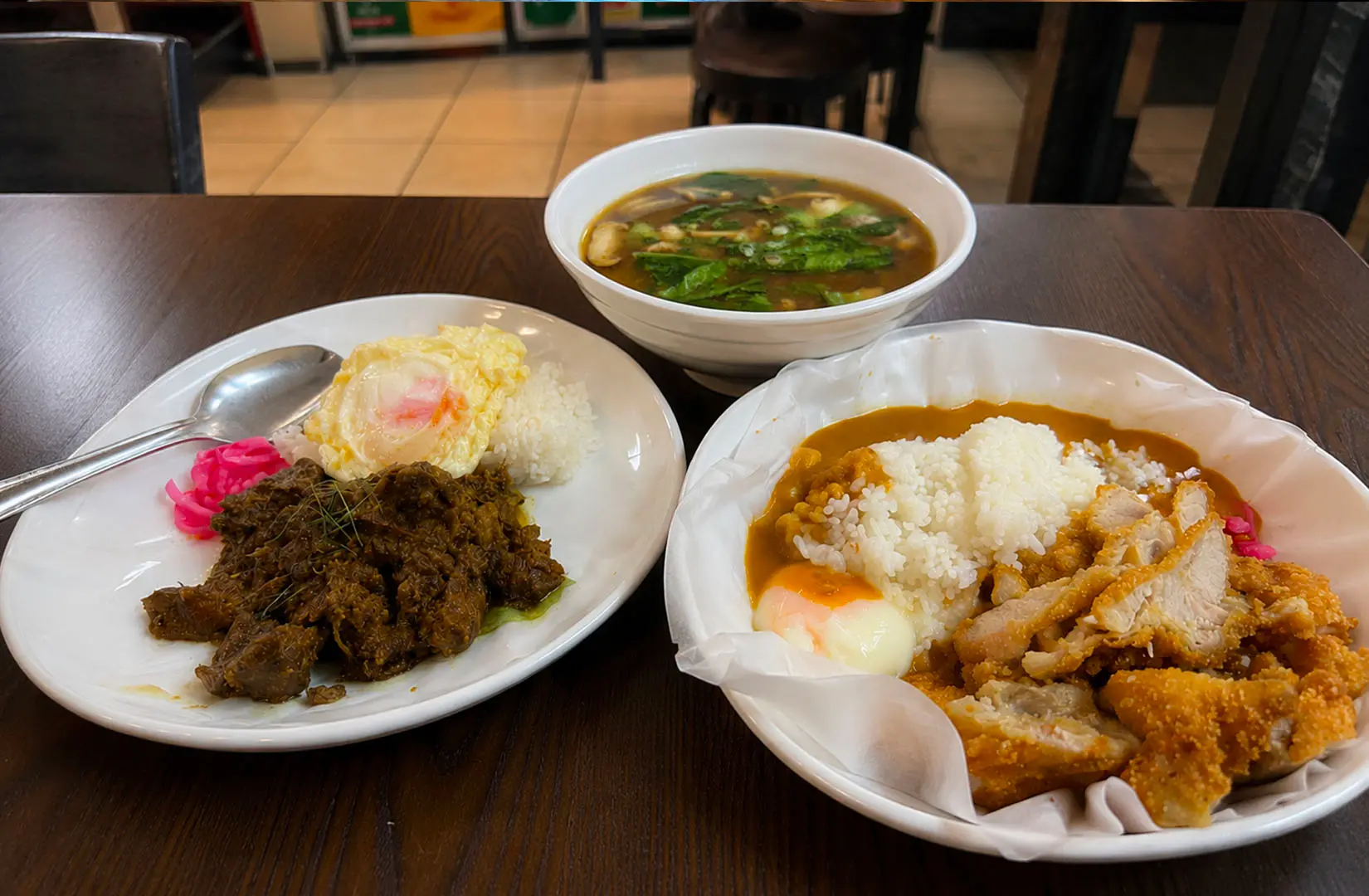 Rice meals with braised meat, fried rice, and soup at New Station Rice Bar, Singapore
