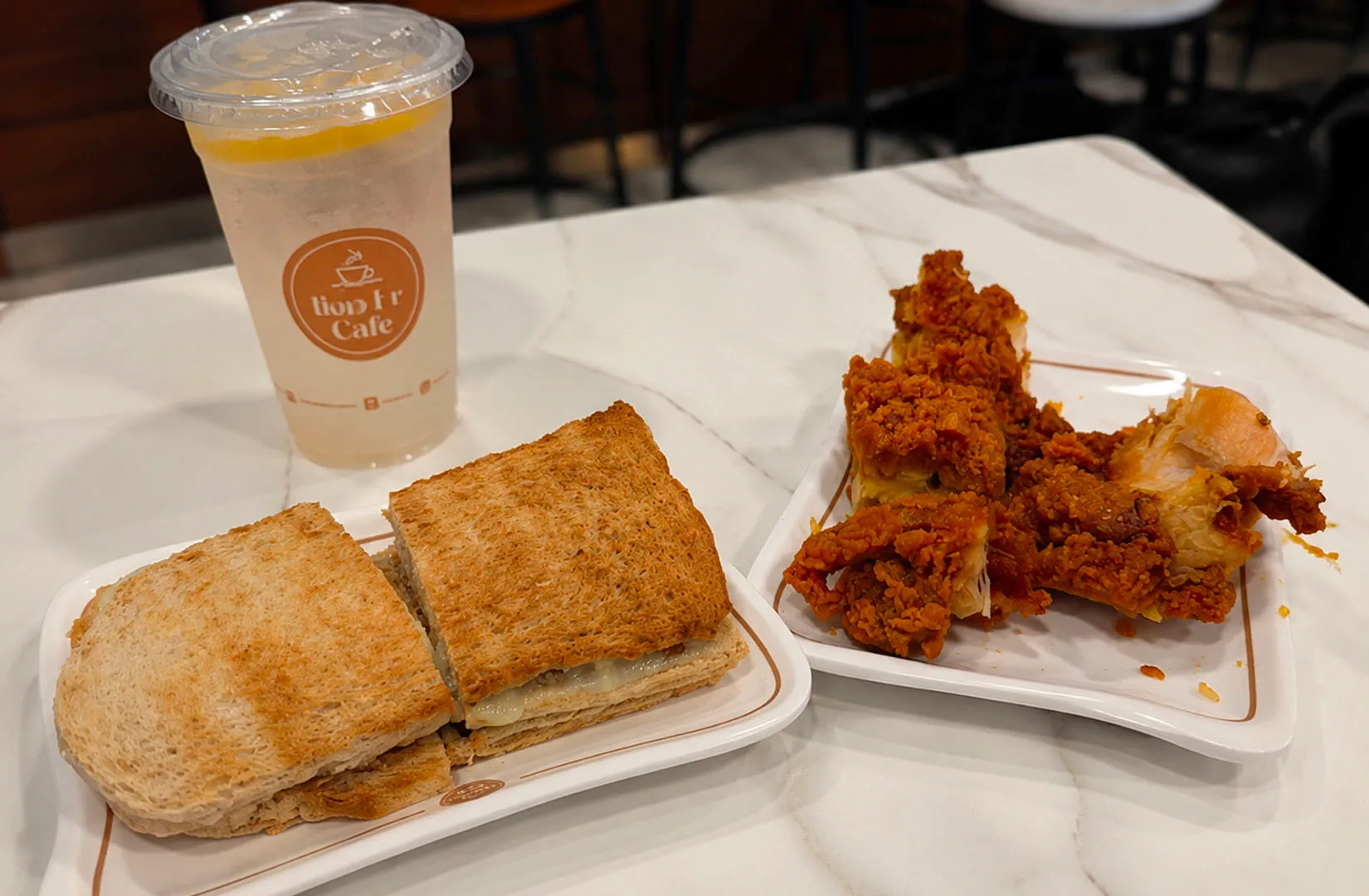 Toast sandwiches and fried chicken with iced drink at Bao Er Cafe