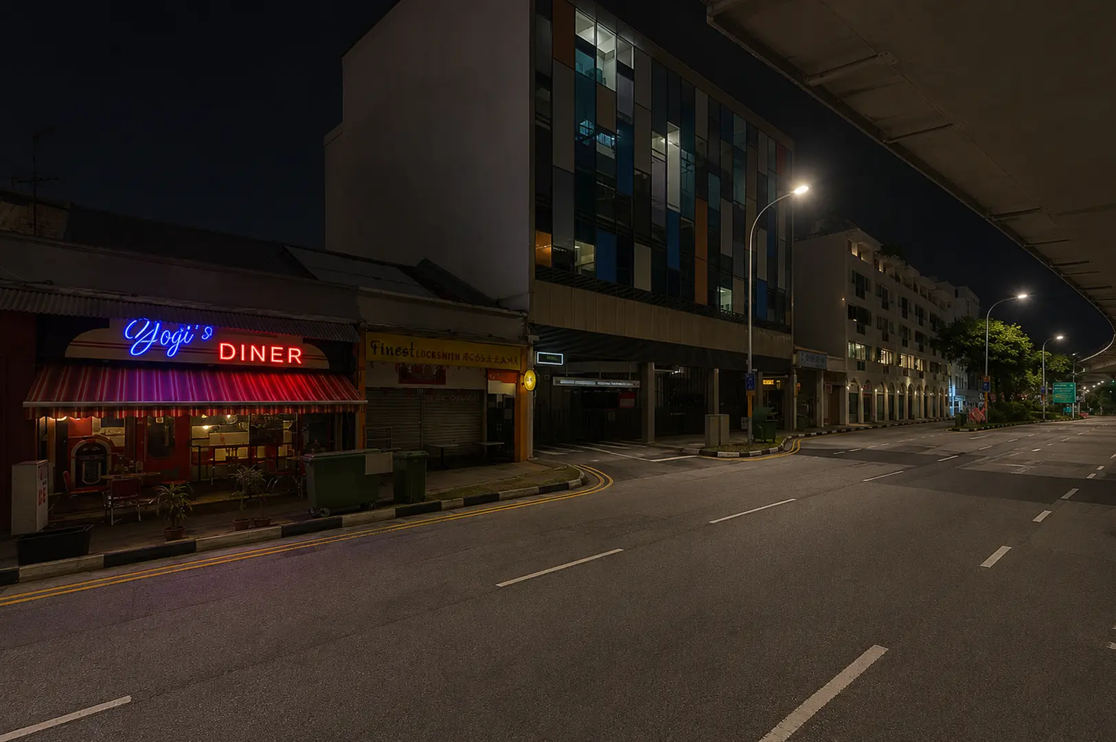 oji’s Diner illuminated along a quiet Serangoon street at night.
