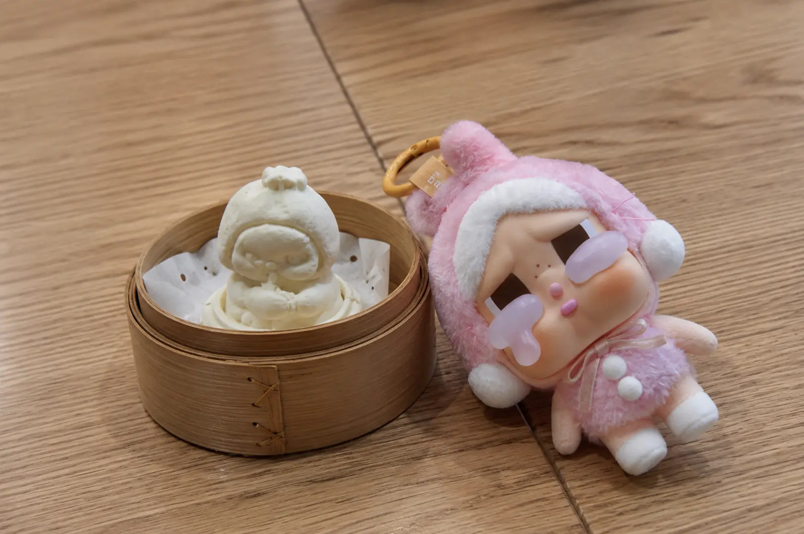 Pop Mart Pop Bakery collectibles displayed on a wooden table in Singapore.