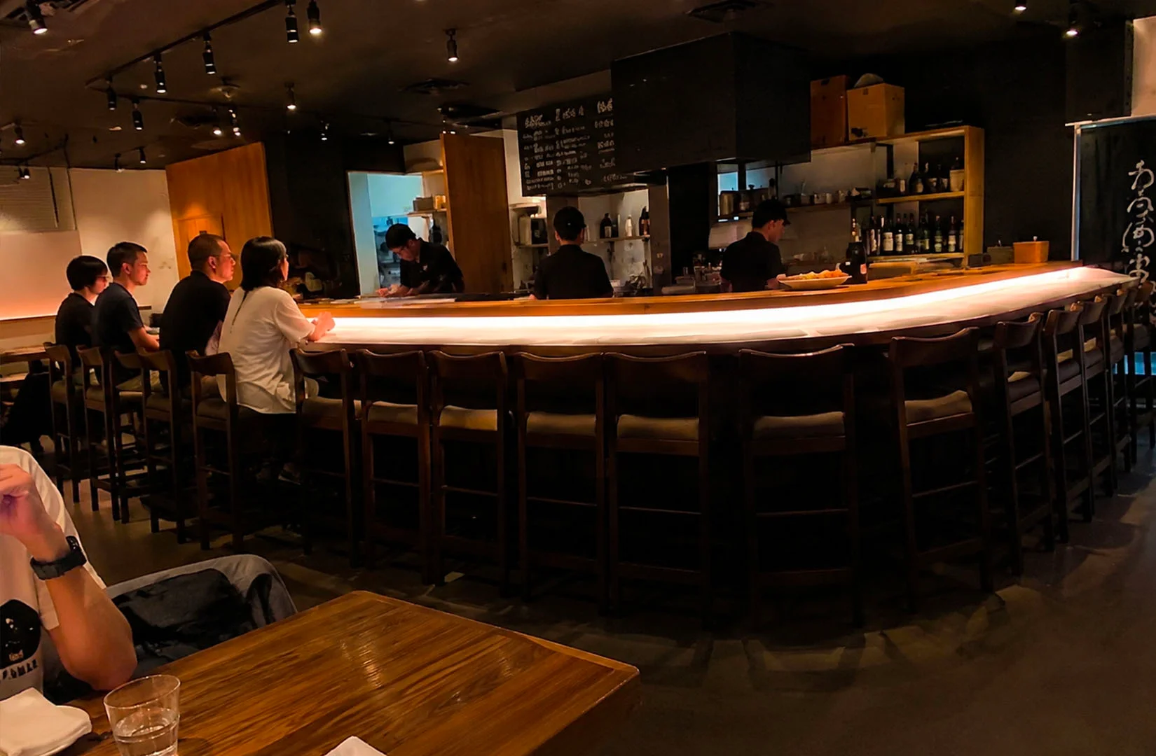 Koji Sushi Bar interior with modern sushi counter seating