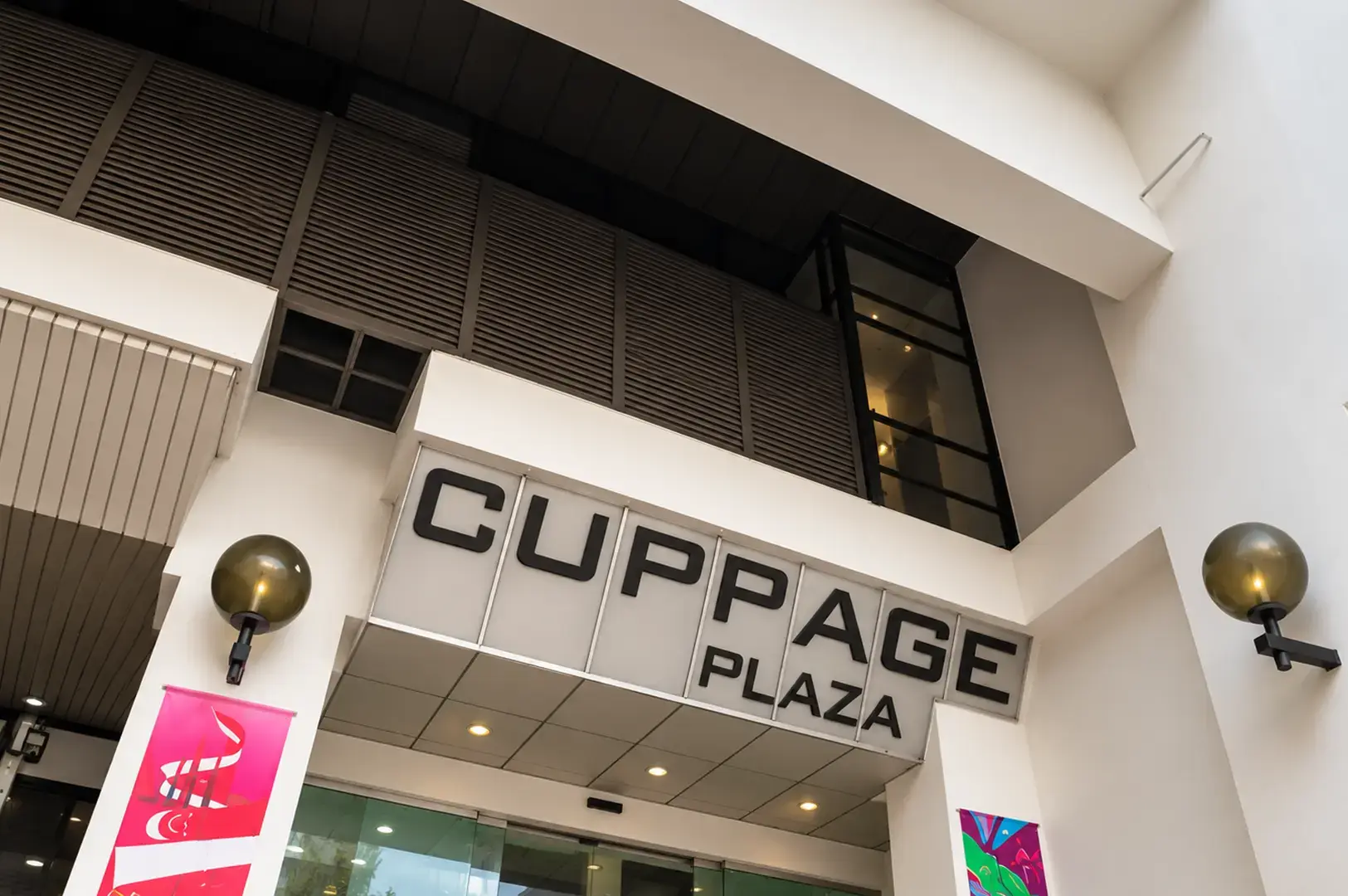 Exterior view of Cuppage Plaza with its distinctive facade and entrance signage.